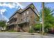 Stunning multi-story brick townhomes with inviting balconies and lush green landscaping at 504 E Howard Ave, Decatur, GA 30030