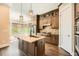 Gourmet kitchen featuring stainless steel appliances, a center island, and ample cabinet space at 504 E Howard Ave, Decatur, GA 30030