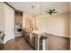 Modern kitchen featuring a large island, stainless steel appliances, and pendant lighting at 504 E Howard Ave, Decatur, GA 30030