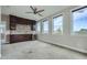 This living room includes a bar and plentiful natural light from the multiple windows at 504 E Howard Ave, Decatur, GA 30030