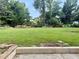 View of the expansive backyard with a large grassy area, ready for outdoor activities and relaxation at 5347 Ocarol Ct, Stone Mountain, GA 30088