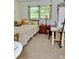 Bedroom featuring neutral carpet, a bed with a nightstand, and natural light from a window at 5347 Ocarol Ct, Stone Mountain, GA 30088