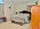 Bedroom with large bed, neutral colored carpet, and decorative furniture at 5347 Ocarol Ct, Stone Mountain, GA 30088
