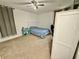 Bedroom featuring neutral colored carpet, a single bed and a rolling desk chair at 5347 Ocarol Ct, Stone Mountain, GA 30088