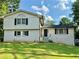 Charming front exterior view showcasing a well-maintained lawn and welcoming entrance at 5347 Ocarol Ct, Stone Mountain, GA 30088