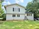 Charming home featuring a well-manicured front lawn and classic architectural details for timeless appeal at 5347 Ocarol Ct, Stone Mountain, GA 30088