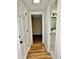 Bright hallway leading to a bathroom and bedroom, enhanced by neutral walls and floors at 5347 Ocarol Ct, Stone Mountain, GA 30088