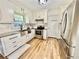 Bright kitchen with stainless steel appliances, granite countertops, and white cabinets at 5347 Ocarol Ct, Stone Mountain, GA 30088