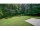A serene backyard offers a quiet retreat, surrounded by lush greenery at 2161 Denson Sw Ln, Marietta, GA 30008