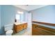 This bathroom features a double sink vanity and a view to the tub area through the mirror at 2161 Denson Sw Ln, Marietta, GA 30008