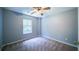This bedroom features a ceiling fan and a window offering natural light at 2161 Denson Sw Ln, Marietta, GA 30008