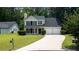 Charming two-story home featuring a well-manicured lawn and a two-car garage at 2161 Denson Sw Ln, Marietta, GA 30008