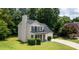 Charming two-story home featuring a well-manicured lawn and a two-car garage at 2161 Denson Sw Ln, Marietta, GA 30008