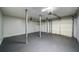 Attached two-car garage with painted walls and concrete floors at 2161 Denson Sw Ln, Marietta, GA 30008