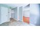 Open hallway leading to various rooms, featuring tile flooring and neutral wall colors at 2161 Denson Sw Ln, Marietta, GA 30008