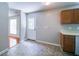 Cozy kitchen corner featuring a door leading outside with wood cabinets above the counter at 2161 Denson Sw Ln, Marietta, GA 30008