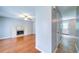 Bright living room featuring hardwood floors, a ceiling fan, and a fireplace at 2161 Denson Sw Ln, Marietta, GA 30008
