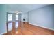 Bright living room featuring hardwood floors, a ceiling fan, and a fireplace at 2161 Denson Sw Ln, Marietta, GA 30008