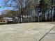 Spacious backyard area featuring a basketball court and fenced perimeter at 4383 Idlewood Ln, Tucker, GA 30084