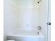 Clean bathroom with white tiled shower and tub combination at 4383 Idlewood Ln, Tucker, GA 30084