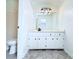 Bathroom featuring decorative vanity with modern light fixture and fixtures at 4383 Idlewood Ln, Tucker, GA 30084