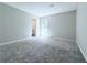 Relaxing bedroom with neutral carpet, large window and en suite bath access at 4383 Idlewood Ln, Tucker, GA 30084