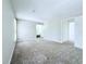 Large bedroom featuring soft carpet, neutral walls, and ensuite bath access at 4383 Idlewood Ln, Tucker, GA 30084