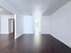 Inviting living area with dark wood floors, white walls, and an open layout for flexible furniture arrangement at 4383 Idlewood Ln, Tucker, GA 30084