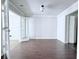 Neutral room featuring dark wood floors, gray walls, access to a porch, and a closet at 4383 Idlewood Ln, Tucker, GA 30084