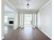 Neutral living room with wood floors, light gray walls, and french doors leading to a screened porch at 4383 Idlewood Ln, Tucker, GA 30084