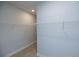 A spacious walk-in closet with white shelving for organized storage solutions at 510 Winston Croft Cir # 56, Johns Creek, GA 30022