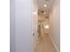 Bright hallway with hardwood floors leading to stairs and kitchen area at 510 Winston Croft Cir # 56, Johns Creek, GA 30022