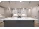 Kitchen with island, white countertops, stainless steel range hood, and pendant lighting at 510 Winston Croft Cir # 56, Johns Creek, GA 30022