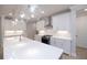 Kitchen island with quartz countertops, stainless steel appliances, and pendant lighting at 510 Winston Croft Cir # 56, Johns Creek, GA 30022