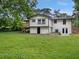 Two-story home with a large backyard, a deck, and plenty of green space at 5207 White Sw Blvd, Mableton, GA 30126