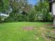 Expansive backyard featuring a lush lawn and mature trees, perfect for outdoor activities at 5207 White Sw Blvd, Mableton, GA 30126
