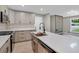 Modern kitchen featuring a large island with quartz countertop and stainless steel appliances at 5207 White Sw Blvd, Mableton, GA 30126