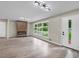 Bright living room with modern fireplace, large windows and hardwood floors at 5207 White Sw Blvd, Mableton, GA 30126