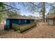 Back view of the blue brick home with a wheelchair ramp leading to the backyard at 1089 Indale Sw Pl, Atlanta, GA 30310