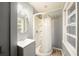 Bathroom featuring a vanity with sink, medicine cabinet, and standing shower at 1089 Indale Sw Pl, Atlanta, GA 30310