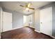 Bright bedroom with hardwood floors, neutral paint, ceiling fan and two closets at 1089 Indale Sw Pl, Atlanta, GA 30310