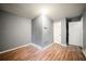 This bedroom features laminate wood flooring, neutral walls, and updated electrical outlets at 1089 Indale Sw Pl, Atlanta, GA 30310