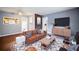 Stylishly decorated living room with hardwood floors, exposed brick, and ample natural light at 1089 Indale Sw Pl, Atlanta, GA 30310