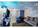 Finished basement area with a couch, bed, and entertainment setup at 1279 Kenilworth Sw Dr, Atlanta, GA 30310