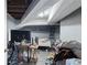 Unfinished basement area with a bed, desk, and closet at 1279 Kenilworth Sw Dr, Atlanta, GA 30310