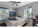 Bright bedroom with a comfortable bed, natural light, and a mini-fridge at 1279 Kenilworth Sw Dr, Atlanta, GA 30310