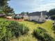 View of spacious backyard and wooden fence, surrounded by lush greenery at 3139 Tuscan Ridge Dr, Snellville, GA 30039