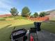 Large, grassy backyard featuring a wooden fence and patio furniture at 3139 Tuscan Ridge Dr, Snellville, GA 30039