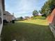 Large, well-maintained backyard featuring a lawn and a wooden fence at 3139 Tuscan Ridge Dr, Snellville, GA 30039