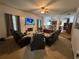 A cozy living room features a fireplace, ceiling fan, and comfortable seating area with multiple recliners at 3139 Tuscan Ridge Dr, Snellville, GA 30039